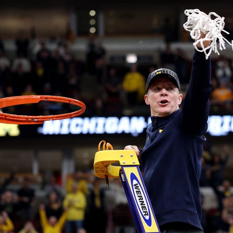 CHICAGO, ILLINOIS - MARCH 29: Head coach Dusty May of the Michigan Wolverines cuts down the net after the game against the Tennessee Volunteers in the Elite Eight of the 2026 NCAA Men's Basketball Tournament at the United Center on March 29, 2026 in Chicago, Illinois. (Photo by Michael Reaves/Getty Images)