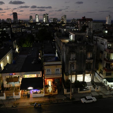 Buildings are illuminated after power was restored following a partial collapse of the electrical grid that left much of western Cuba in the dark in December 2025.