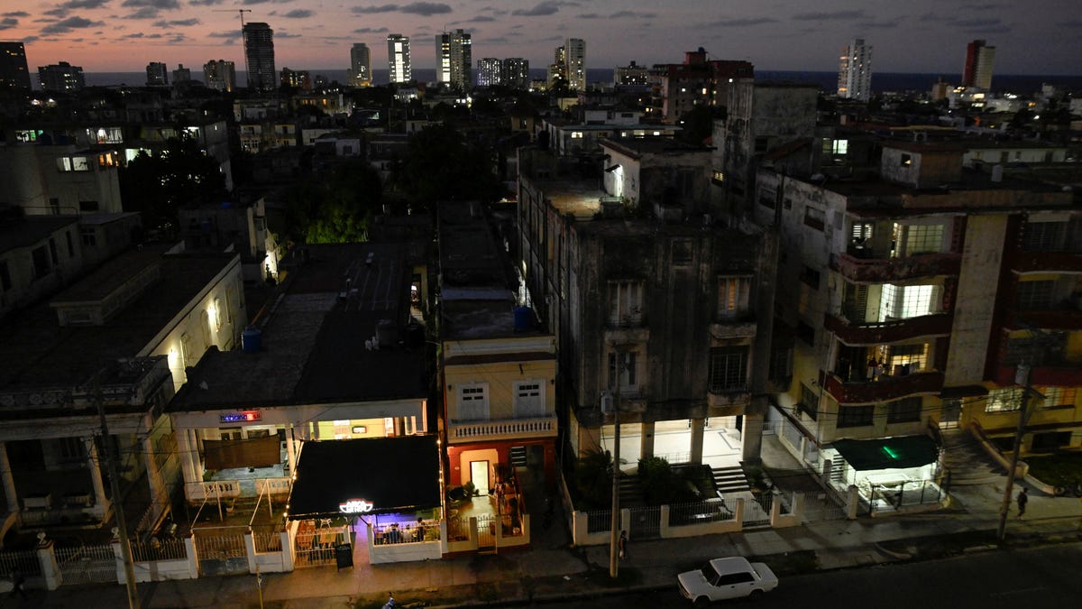 Buildings are illuminated after power was restored following a partial collapse of the electrical grid that left much of western Cuba in the dark in December 2025.