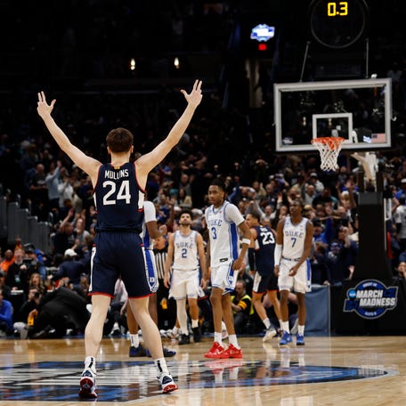 UConn Huskies guard Braylon Mullins (24) celebrates after making the game-winning three-point basket against the Duke Blue Devils in the second half during an Elite Eight game of the East Regional of the men's 2026 NCAA Tournament at Capital One Arena.