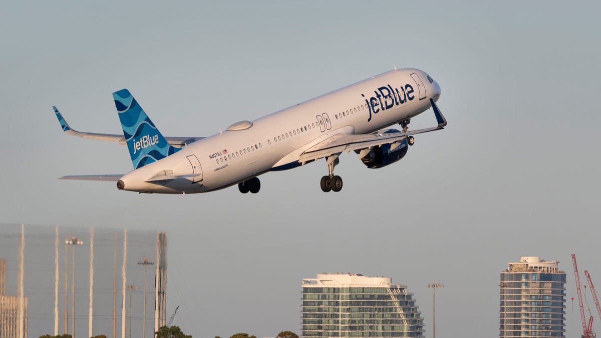A JetBlue plane takes off at Palm Beach International Airport in West Palm Beach, Florida on February 7, 2025.