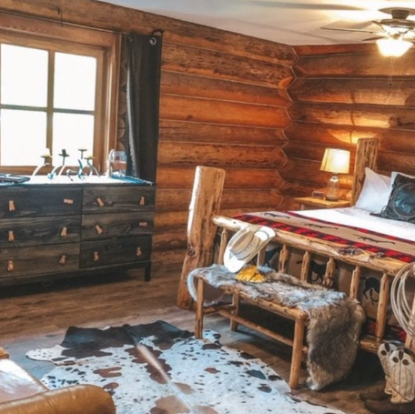 Cozy cabins at Three Bars Ranch have front porches for relaxing.