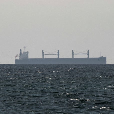 A cargo ship in the Gulf, near the Strait of Hormuz, as seen from northern Ras al-Khaimah, near the border with Oman’s Musandam governance, amid the U.S.-Israeli conflict with Iran, in United Arab Emirates, March 11, 2026.