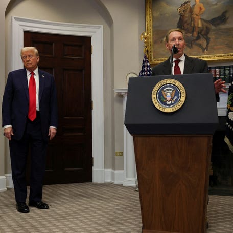 U.S. President Donald Trump reacts after delivering remarks on AI infrastructure as Oracle co-founder Larry Ellison speaks at the Roosevelt room at White House in Washington, D.C. on January 21, 2025.