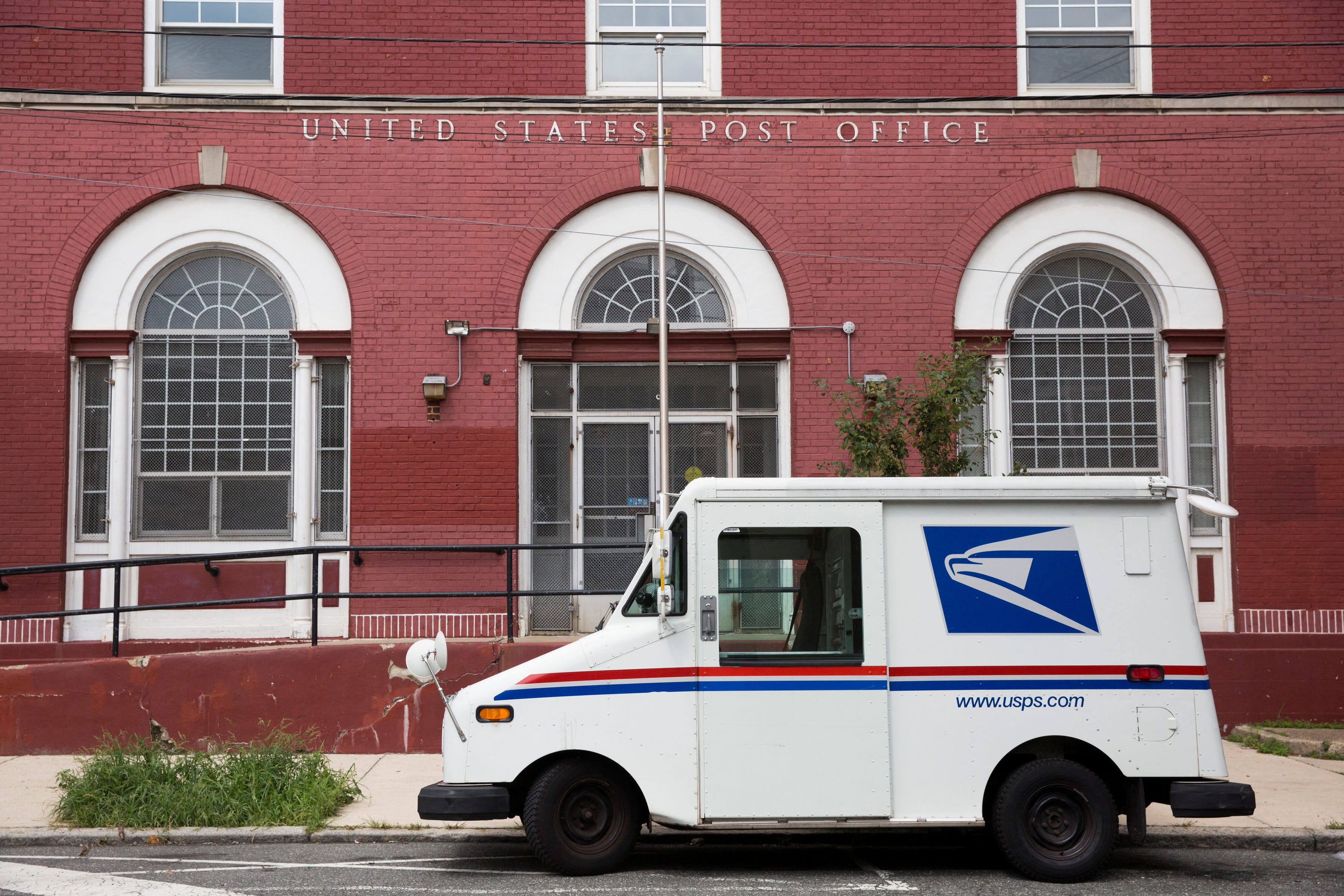 Postal worker delivering mail