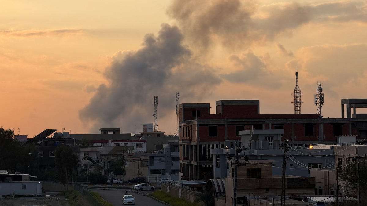 Smoke rises following an airstrike on a Popular Mobilization Forces (PMF) headquarters at Kirkuk International Airport, in Kirkuk, Iraq, March 28, 2026. REUTERS/Ako Rasheed