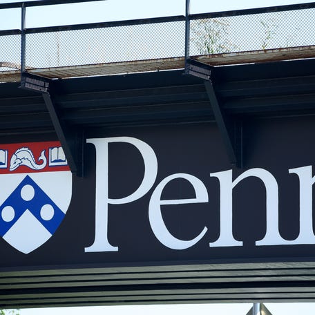 A university logo adorns a railroad bridge on the campus of the University of Pennsylvania in Philadelphia, Pennsylvania, on Sept. 25, 2017.