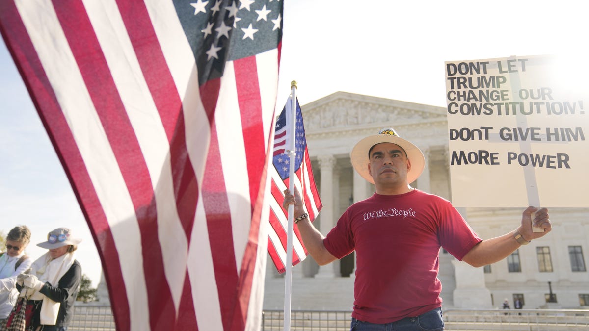 Scenes from outside the court: demonstrators, signs and security as justices hear arguments in Trump v. Barbara.