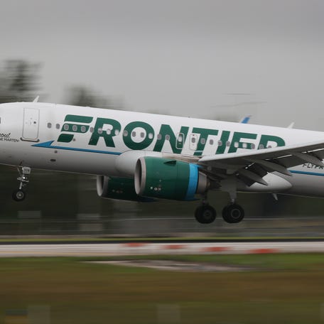A Frontier airlines plane lands at the Miami International Airport on June 16, 2021 in Miami, Florida