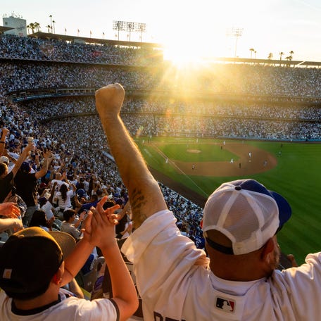 Los Angeles Dodgers fans celebrate Andy Pages' 3-run homer in the fifth on Opening Day at Dodger Stadium on March 26, 2026,.