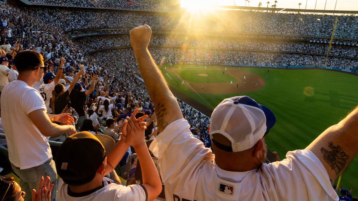 Los Angeles Dodgers fans celebrate Andy Pages' 3-run homer in the fifth on Opening Day at Dodger Stadium on March 26, 2026,.