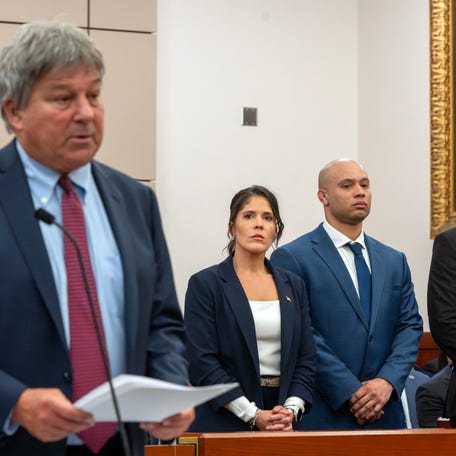 Special prosecutor David Meier speaks as Lt. Jennifer Penton and troopers David Montanez and Edwin Rodriguez, left to right, are arraigned in Worcester Superior Court April 2. They are charged with manslaughter in the death of Enrique Delgado-Garcia.