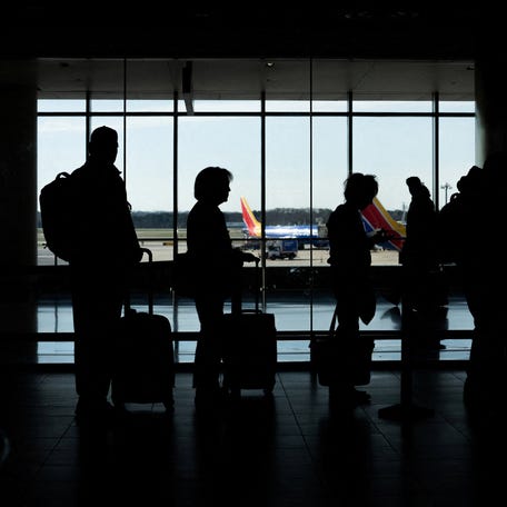 FILE PHOTO: Passengers wait in a TSA security checkpoint queue that stretches through Baltimore/Washington International Thurgood Marshall Airport (BWI) in Baltimore, Maryland., U.S., March 29, 2026. REUTERS/Aaron Schwartz/File Photo
