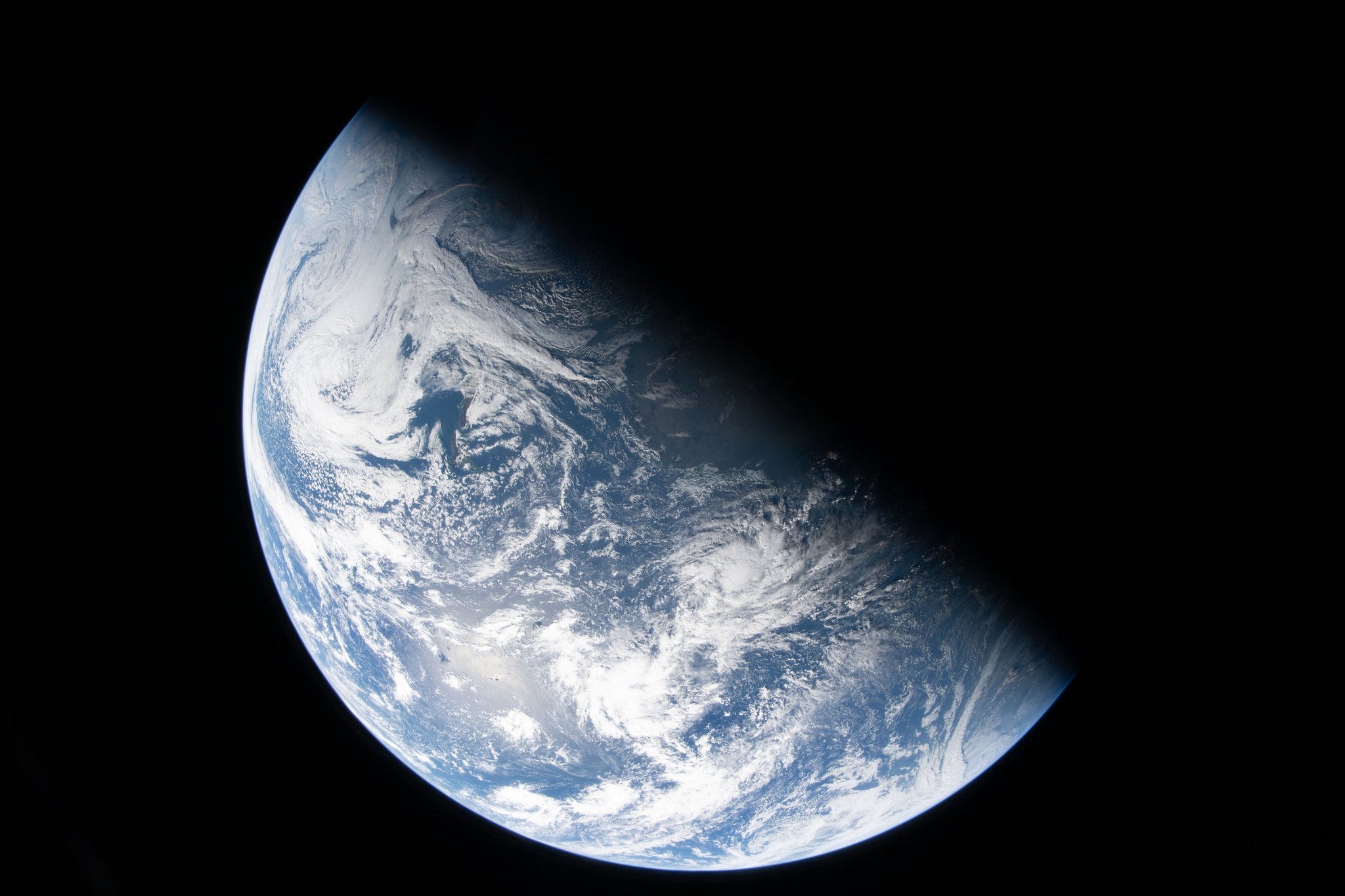 NASA's latest photos from the Artemis II mission show Earth in stunning details as the astronauts near a milestone distance of 100,000 miles away.