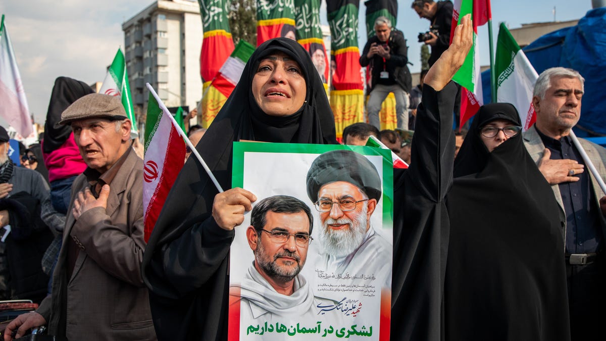 Mourners are pictured during a funeral procession held for IRGC Navy Chief Alireza Tangsiri, alongside other senior naval commanders and their families who were killed in US-Israeli strikes.