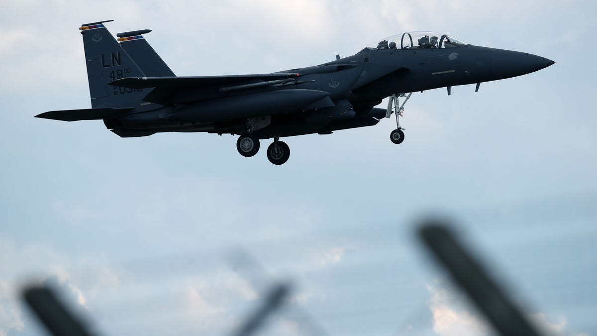 A US Air Force F-15E Strike Eagle fighter jet prepares to land at RAF Lakenheath in England on June 15, 2020.
