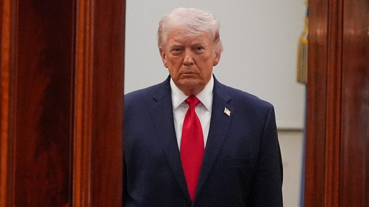 President Donald Trump arrives from the Blue Room to speak about the Iran war from the Cross Hall of the White House on Wednesday, April 1, 2026, in Washington.