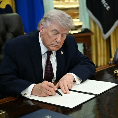 President Donald Trump signs an executive order at the White House in Washington, DC, on March 31, 2026, restricting mail-in voting.