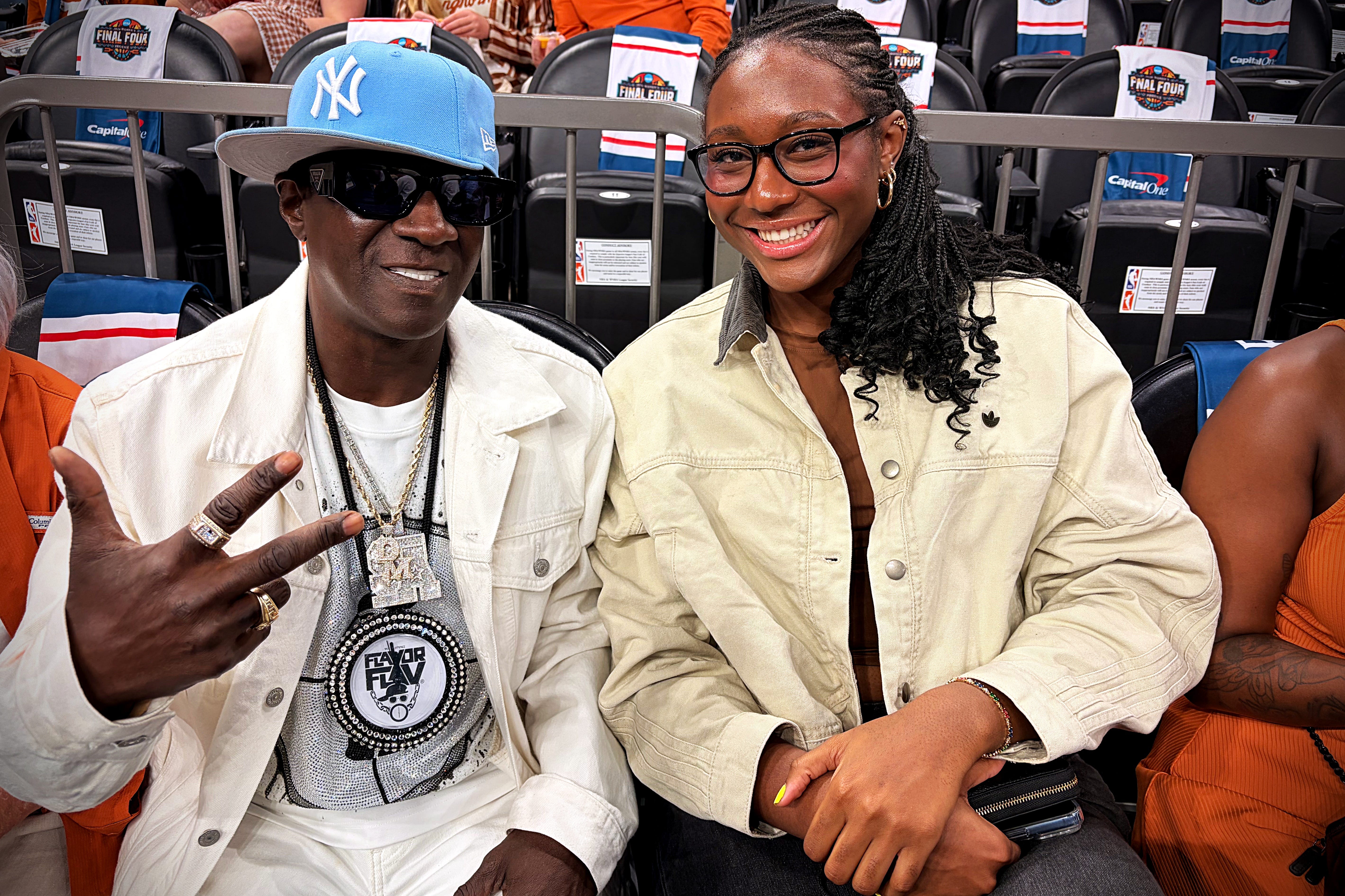Flavor Flav was sitting courtside with WNBA star Aliyah Boston at the Final Four on Friday in Phoenix, while Diana Taurasi sits with Paige Bueckers.