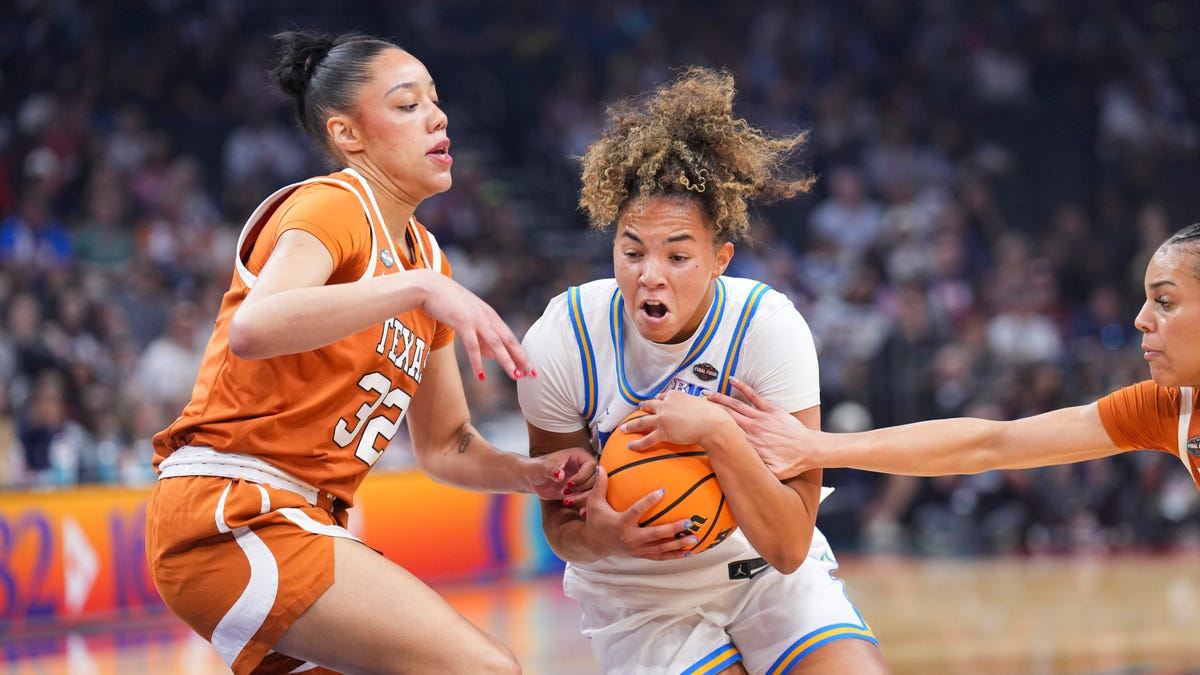 UCLA Bruins guard Kiki Rice (1) drives to the basket against Texas Longhorns forward Teya Sidberry (32) during the first half of a national semifinal.