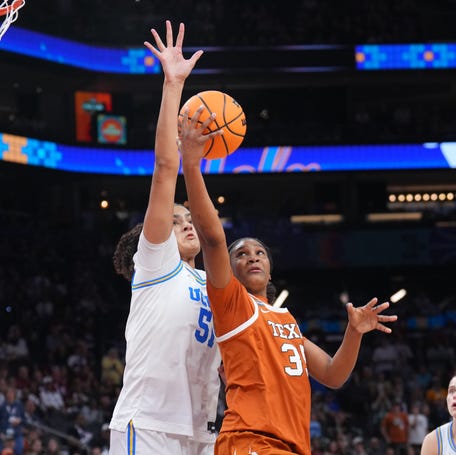 Apr 3, 2026; Phoenix, AZ, USA; Texas Longhorns forward Madison Booker (35) shoots against UCLA Bruins center Lauren Betts (51) during the second half of a semifinal of the Final Four of the women's 2026 NCAA Tournament at Mortgage Matchup Center. Mandatory Credit: Joe Camporeale-Imagn Images