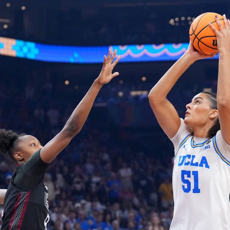 Apr 5, 2026; Phoenix, AZ, USA; UCLA Bruins center Lauren Betts (51) shoots against South Carolina Gamecocks forward Joyce Edwards (8) in the first half during the National Championship game of the women's 2026 NCAA Tournament at Mortgage Matchup Center. Mandatory Credit: Joe Camporeale-Imagn Images