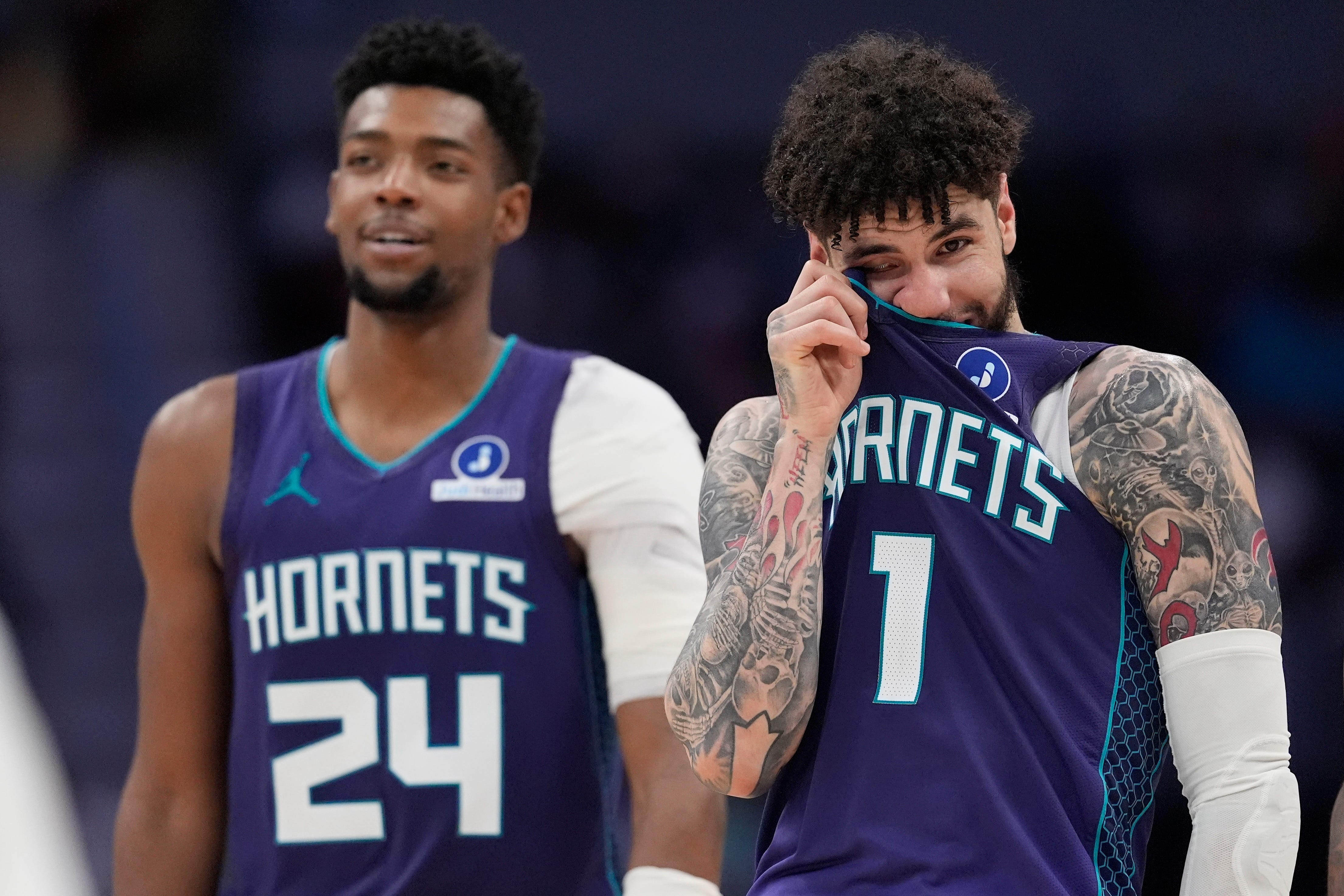 NBA game action with players competing