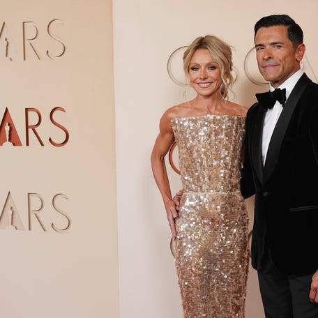 Kelly Ripa, left, and Mark Consuelos attend the Oscars on March 15, 2026, in Hollywood, California.
