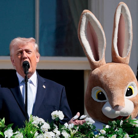 President Donald Trump speaks next to the Easter Bunny during the 2026 White House Easter Egg Roll at the White House in Washington, D.C., U.S., April 6, 2026.