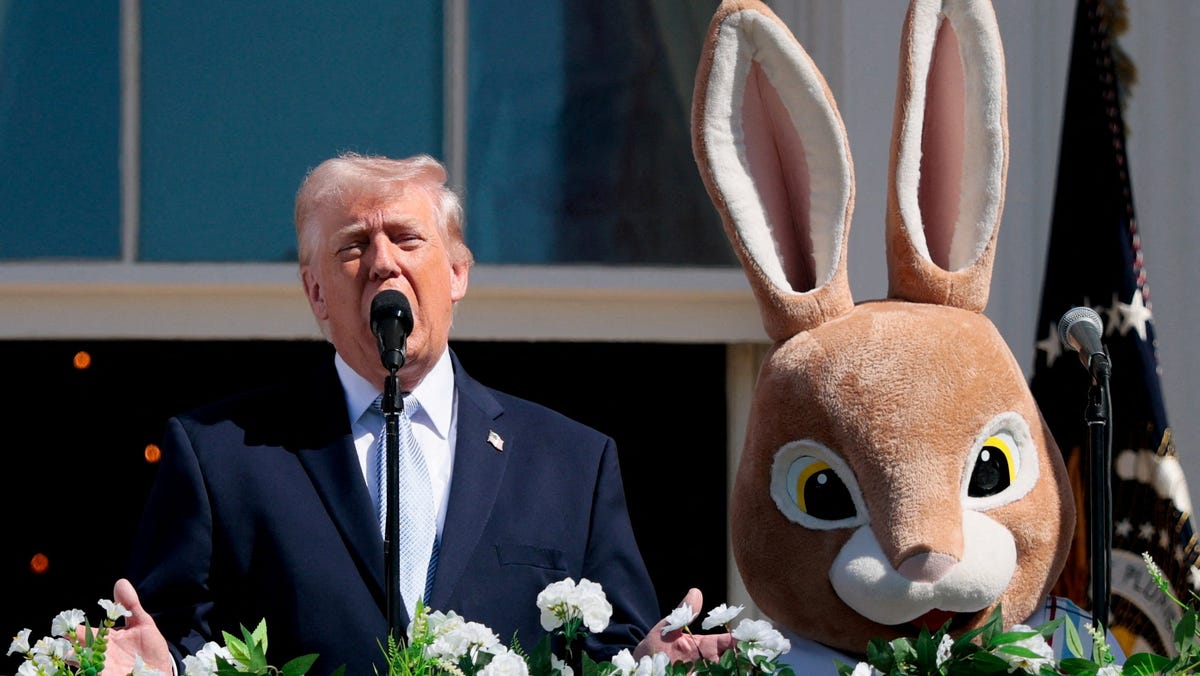 President Donald Trump speaks next to the Easter Bunny during the 2026 White House Easter Egg Roll at the White House in Washington, D.C., U.S., April 6, 2026.