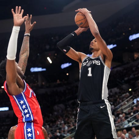 \San Antonio Spurs forward Victor Wembanyama (1) shoots against the Philadelphia 76ers during the first half of their game on April 6, 2026.