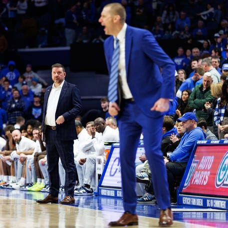 Jan 24, 2026; Lexington, Kentucky, USA; Mississippi Rebels head coach Chris Beard looks on as Kentucky Wildcats head coach Mark Pope yells to his players during the second half at Rupp Arena at Central Bank Center. Mandatory Credit: Jordan Prather-Imagn Images