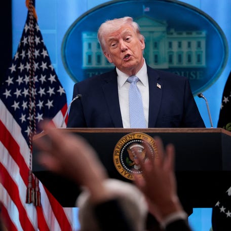 Reporters raise their hands to ask questions as U.S. President Donald Trump holds a press conference in the James S. Brady Press Briefing Room at the White House in Washington, D.C., U.S., April 6, 2026.