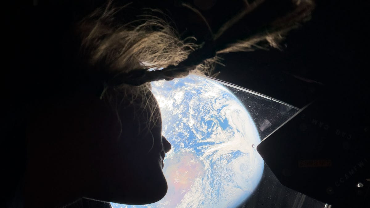 Spaceship Earth
NASA astronaut and Artemis II mission specialist Christina Koch peers out of one of the Orion spacecraft's main cabin windows, looking back at Earth, as the crew travels towards the Moon.