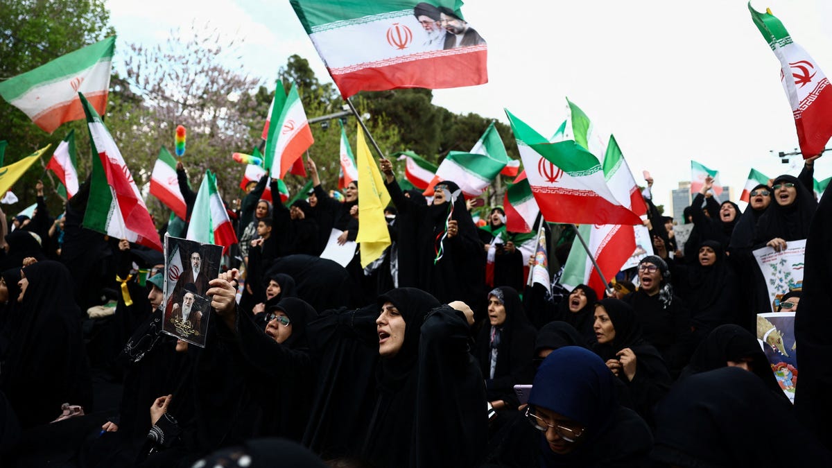 Iranian people attend a ceremony marking 40 days since schoolchildren were killed in a strike on a girls' primary school in Minab, amid the U.S.-Israeli conflict with Iran, in Tehran, Iran, April 7, 2026.