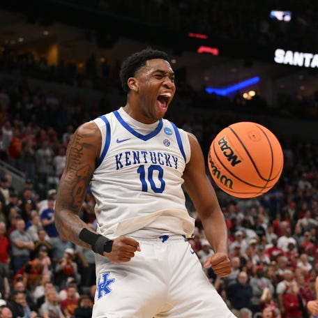 Mar 20, 2026; St. Louis, MO, USA; Kentucky Wildcats forward Brandon Garrison (10) reacts after dunking the ball against the Santa Clara Broncos during the overtime period of a first round game of the men's 2026 NCAA Tournament at Enterprise Center. Mandatory Credit: Jeff Curry-Imagn Images