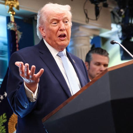 President Donald Trump, flanked by Secretary of Defense Pete Hegseth, addresses reporters at the White House in Washington, DC, on April 6, 2026.