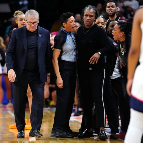 South Carolina head coach Dawn Staley (right) yells at Connecticut head coach Geno Auriemma at Mortgage Matchup Center during the Women's Final Four in Phoenix on April 3, 2026.
