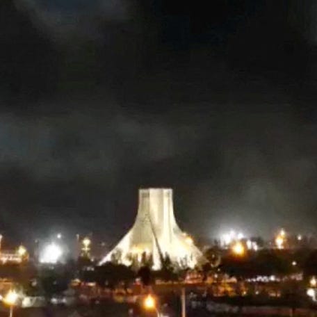 Smoke rises over Azadi Square following a strike, amid the U.S.-Israeli conflict with Iran, in Tehran, on April 6, 2026.