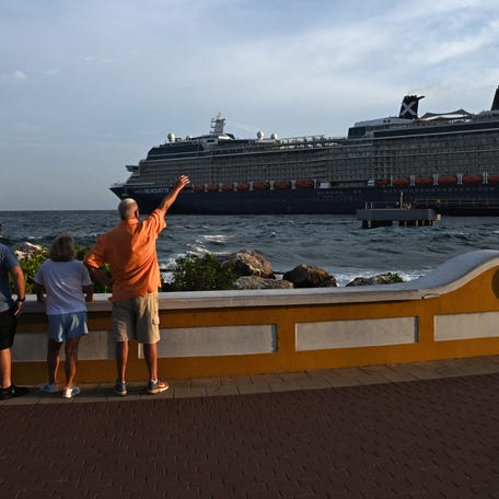 Tourists look at the Celebrity Silhouette cruise ship, from the old town of Willemstad, Curacao, in the Dutch Caribbean, on April 7, 2026.