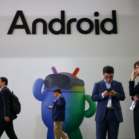 Visitors stand next to an Android placard at the Mobile World Congress (MWC) at Fira de Barcelona, Spain, March 2, 2026.