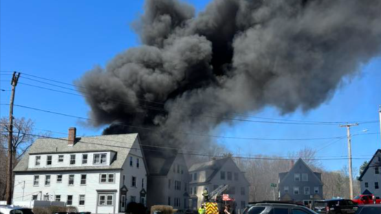 Thick smoke poured from the house at Twinehurst Place, off Central Street.