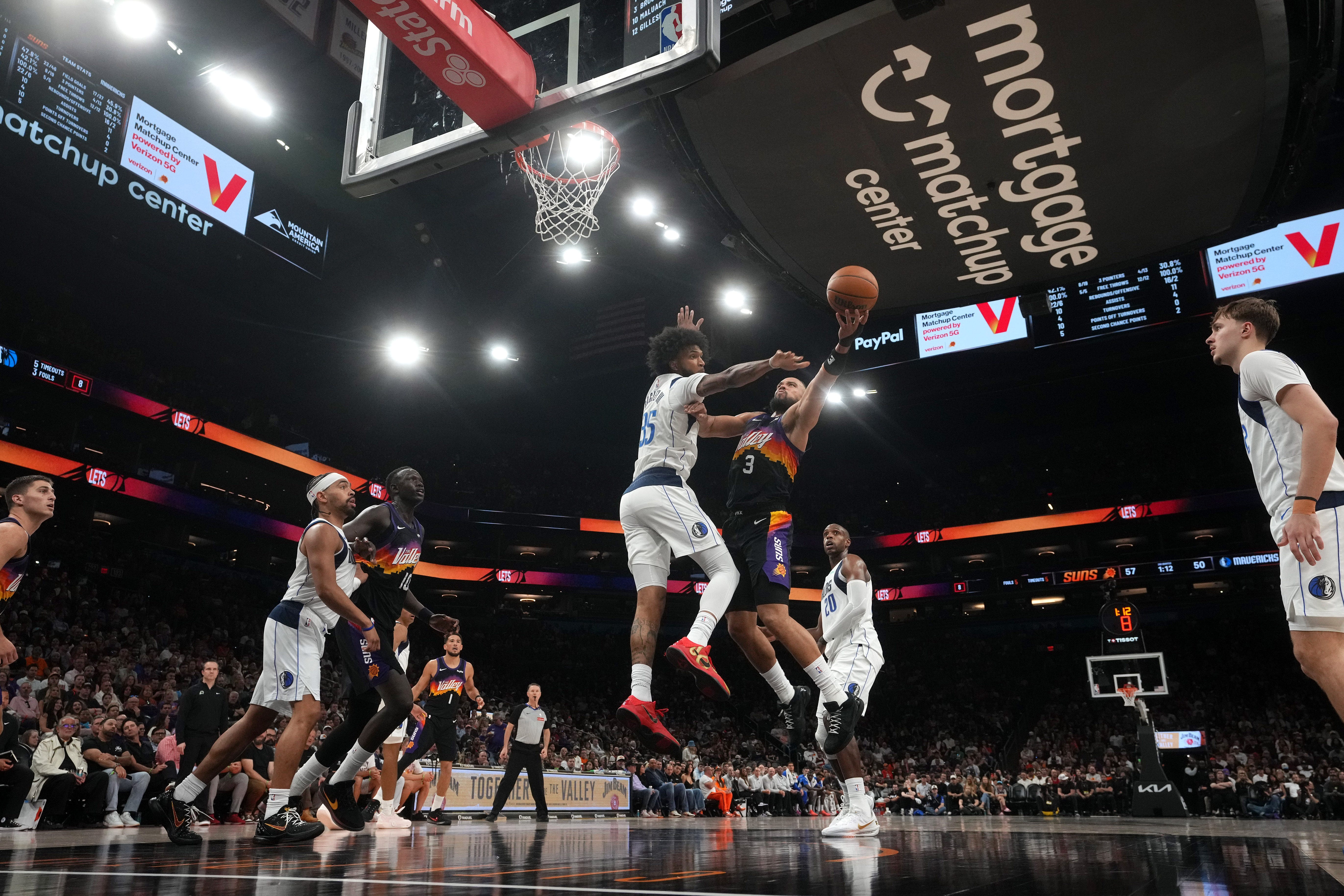 Maluach defending at the rim