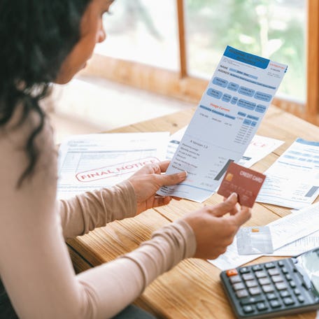 Stressed young woman has financial problems with credit card debt to pay crucial show concept of bad personal money and mortgage pay management crisis.