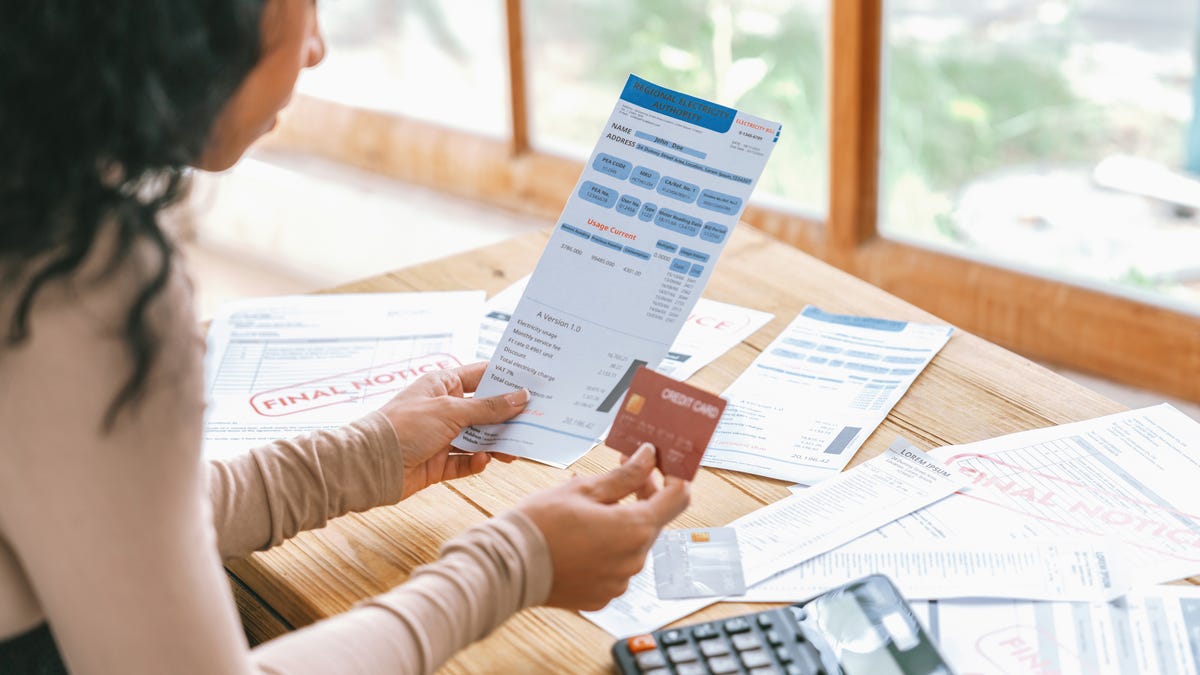 Stressed young woman has financial problems with credit card debt to pay crucial show concept of bad personal money and mortgage pay management crisis.