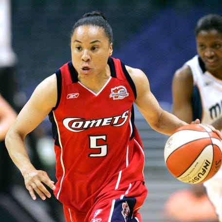 Houston Comets guard Dawn Staley brings the ball up court against the Washington Mystics on May 13, 2006. Staley is the starting point guard for the Comets, is head coach at Temple and coaches Team USA.