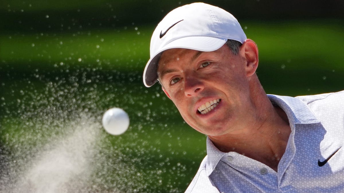 Rory McIlroy plays a shot from a bunker on the seventh hole during the second round of the 2026 Masters Tournament at Augusta National Golf Club.