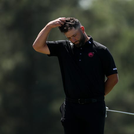 Jon Rahm reacts on the 18th green during the second round of the 2026 Masters Tournament at Augusta National Golf Club.