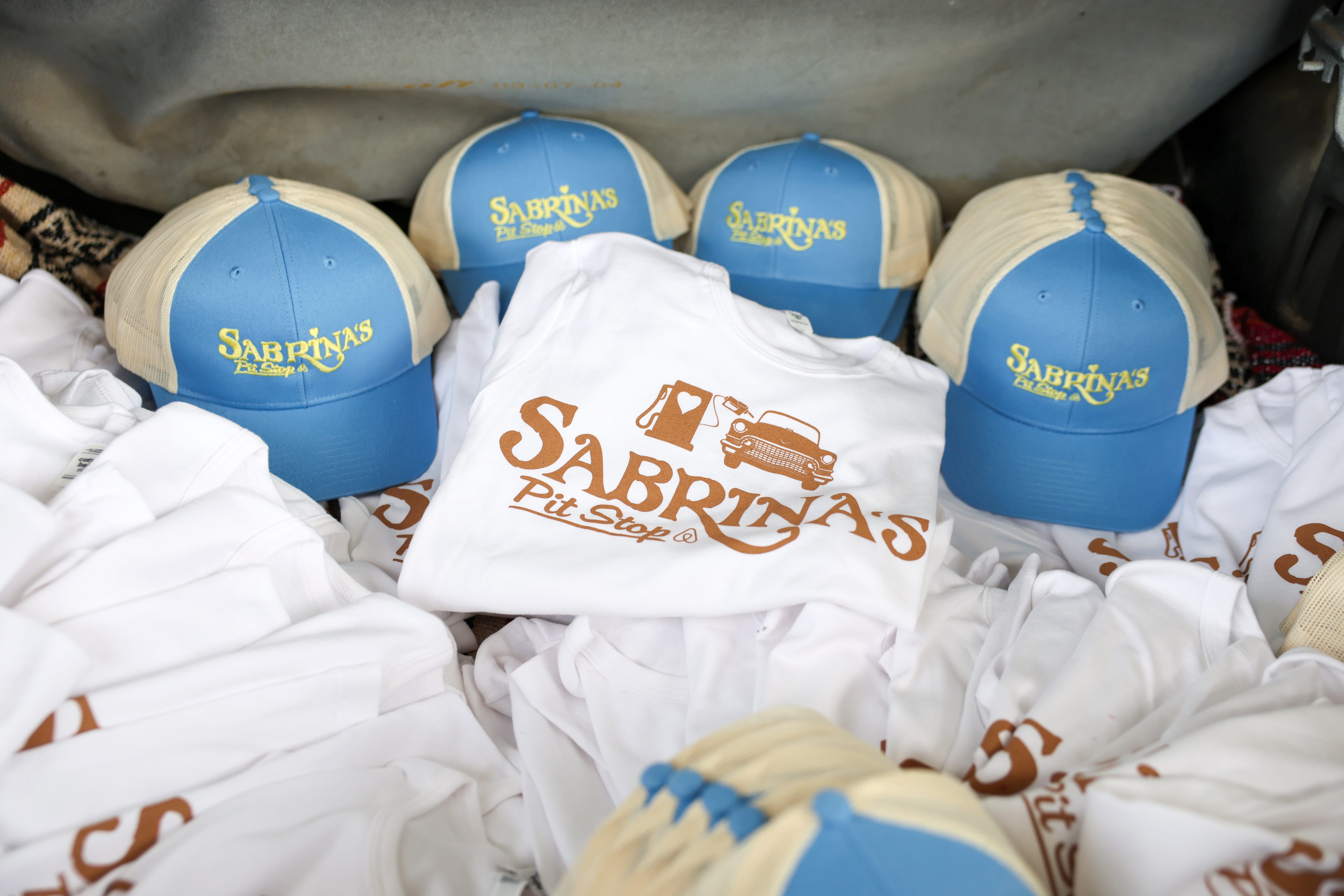 Limited‑edition merch was available at “Sabrina’s Pit Stop” presented by Airbnb and Sabrina Carpenter.