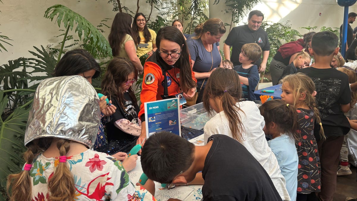 People gathered at the San Diego Air & Space Museum to watch the splashdown.